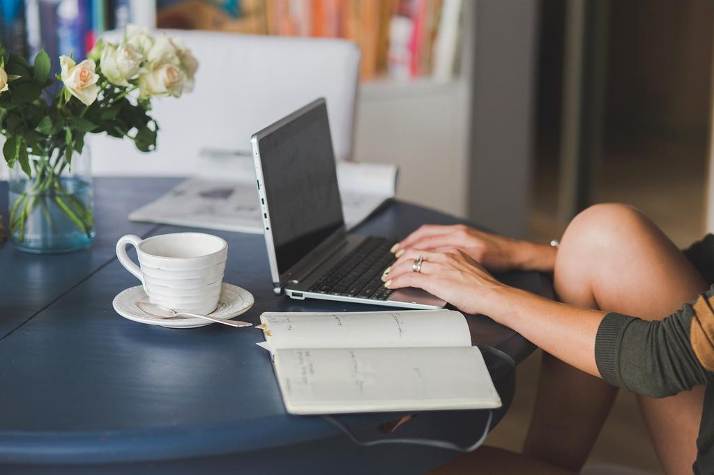 Modern content creator working with multiple screens showing blog analytics and title suggestions